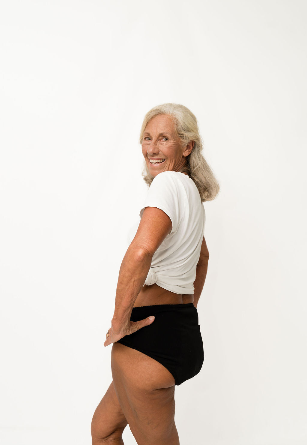 Person wearing a black t-shirt and Brolly underwear on a white background - Black