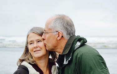 Man kissing his partner on the cheek