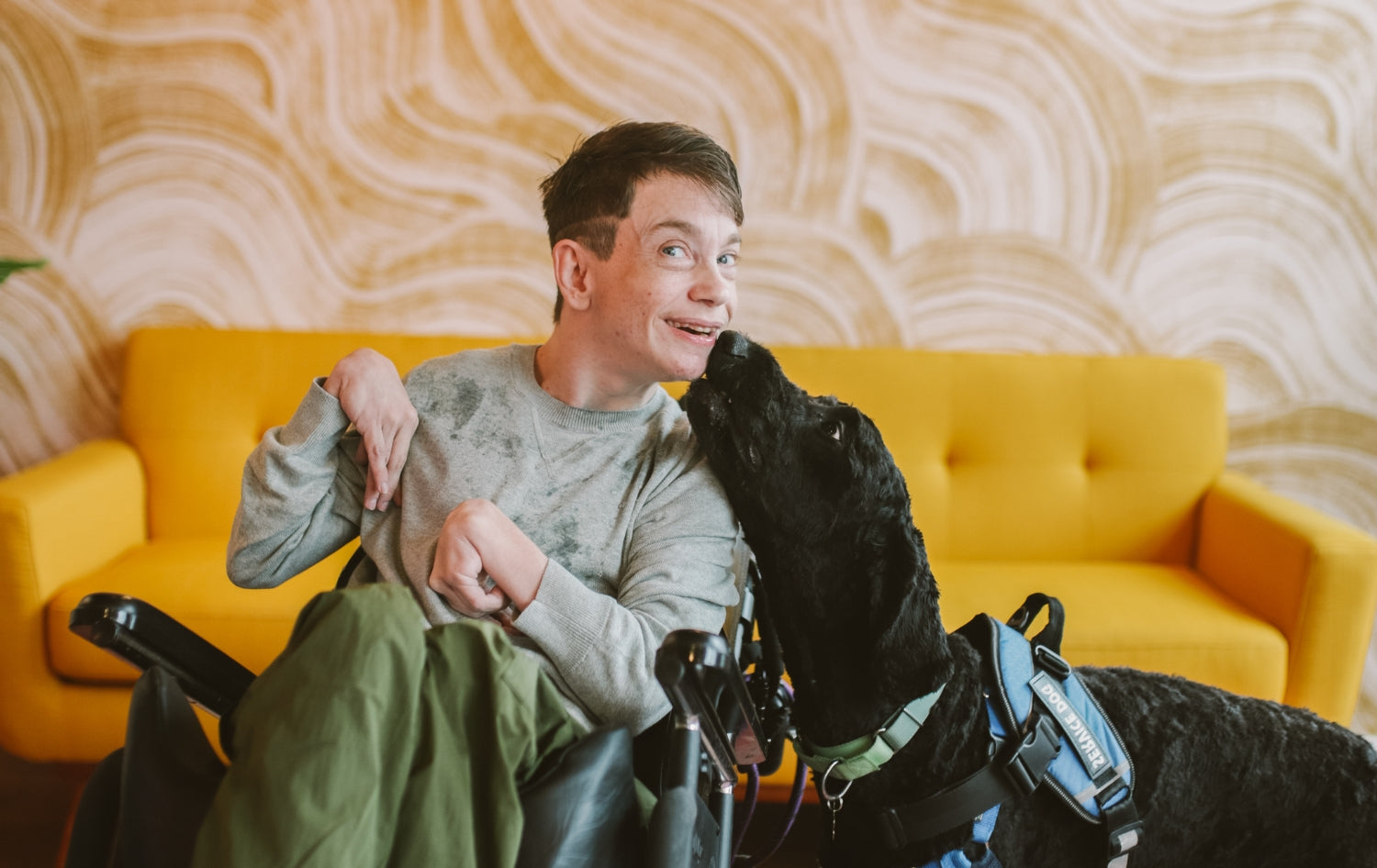Disability boy smiling with dog