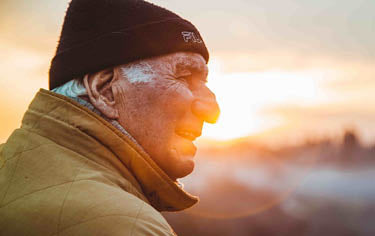 Elderly man at sunset time