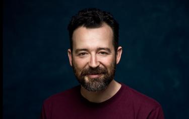 Man name Sam smile in the photo