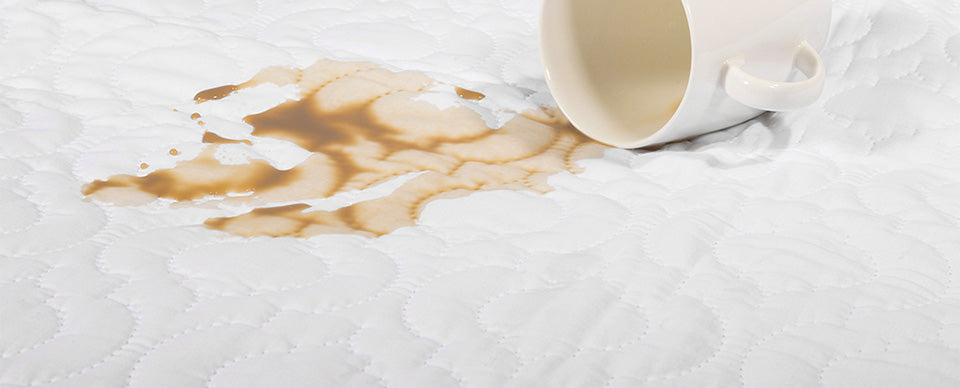 Coffee splash on waterproof sheet