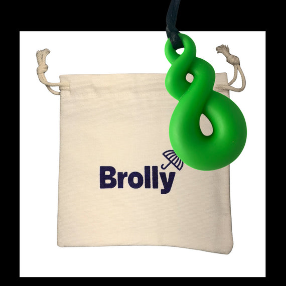 Beige drawstring pouch and Shark Tooth-shaped Brolly Chew Necklace on a black cord against a white background - Blue