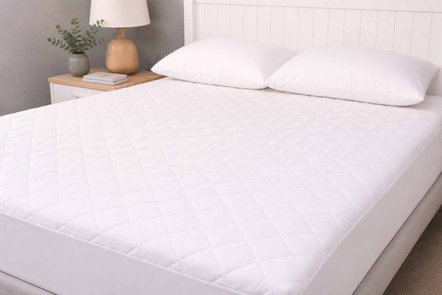 full bed on adult bedroom featuring essential mattress protector white for toilet training and bedwetting protection